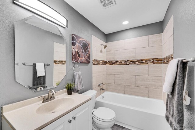 7902 Meade St Unit A10, Westminster, CO 80030 - full bathroom featuring a textured wall, toilet, washtub / shower combination, and vanity