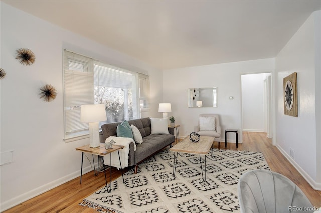 living room featuring baseboards and wood finished floors