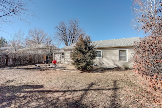 back of house with a patio area and fence