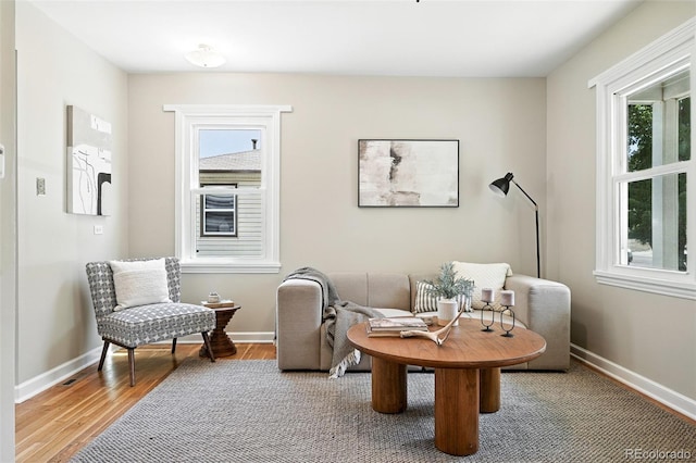 2000 S King St, Denver, CO 80219 - sitting room featuring healthy amount of natural light and wood finished floors