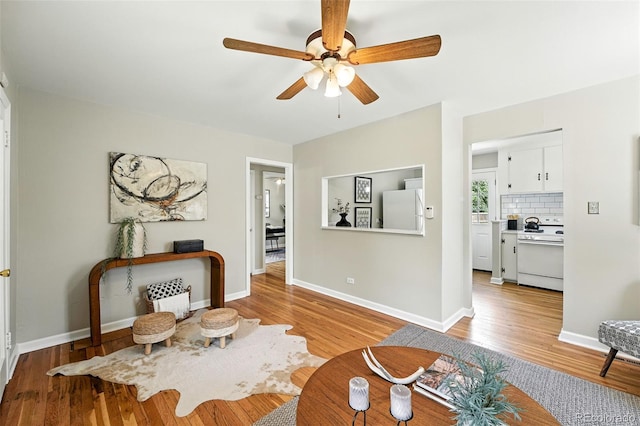 2000 S King St, Denver, CO 80219 - living room with light wood-style floors and a ceiling fan