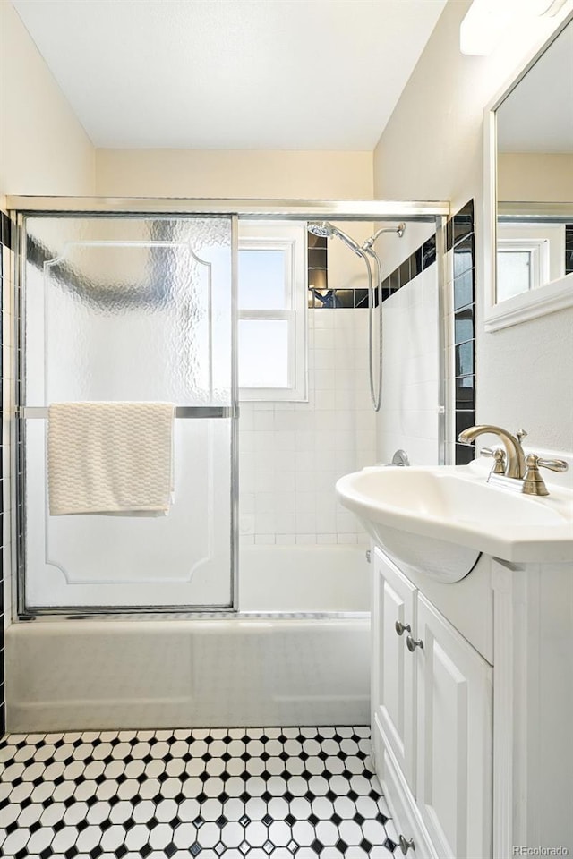 2000 S King St, Denver, CO 80219 - bathroom with vanity and shower / bath combination with glass door