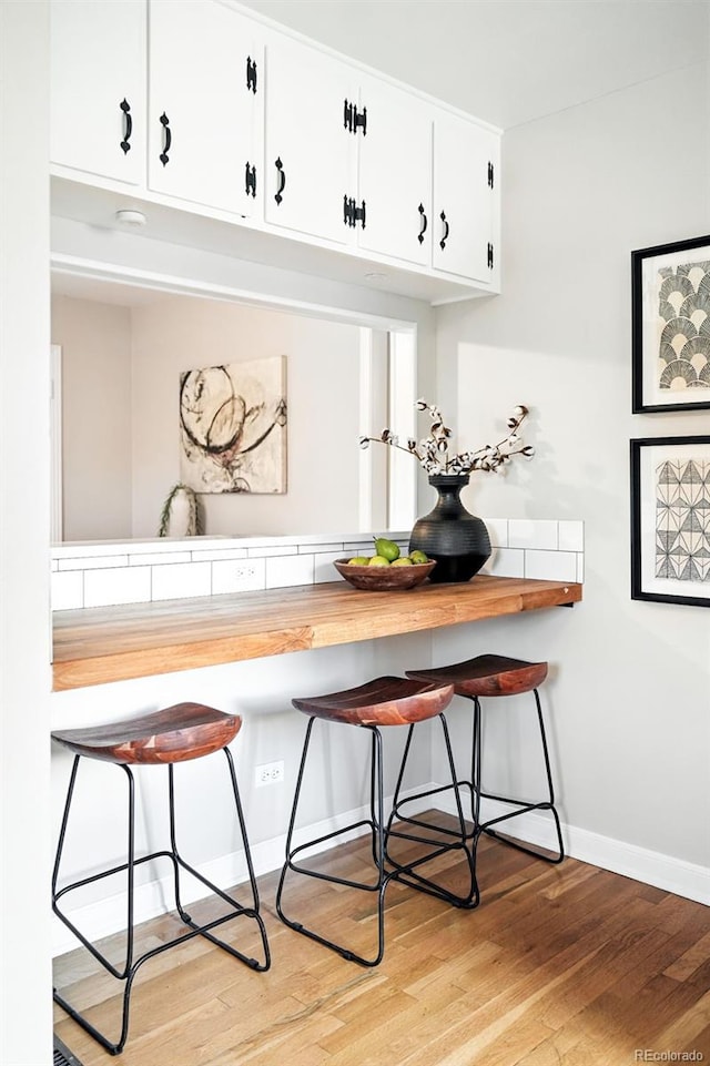 2000 S King St, Denver, CO 80219 - bar with light wood finished floors and baseboards