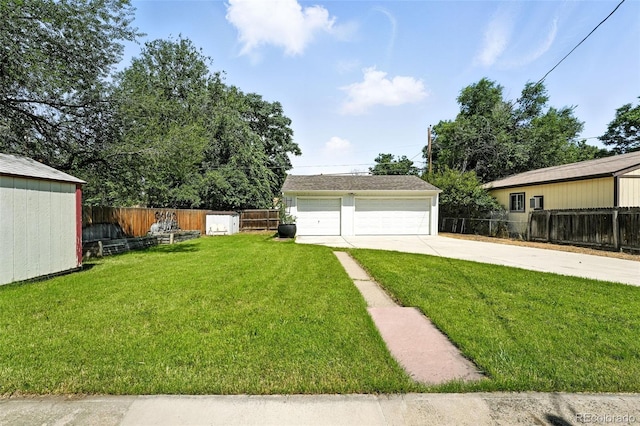 2000 S King St, Denver, CO 80219 - view of yard featuring an outbuilding and a garage