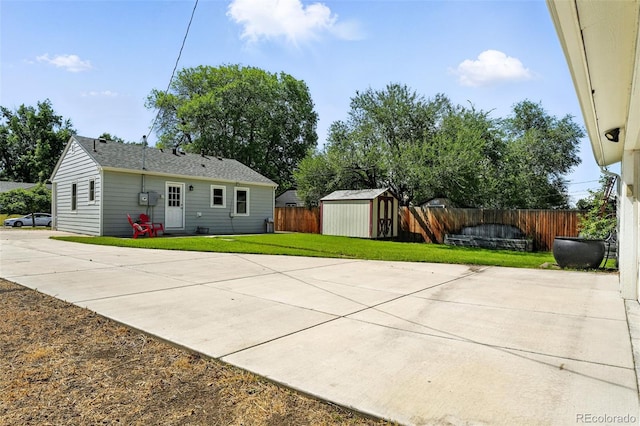 2000 S King St, Denver, CO 80219 - back of house with a storage shed, a fenced backyard, and a patio area