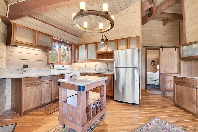 693 Rd C, Pine, CO 80470 - kitchen with freestanding refrigerator, wooden ceiling, wooden walls, light wood-style floors, and open shelves