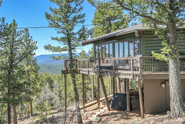 693 Rd C, Pine, CO 80470 - view of yard with a deck with mountain view