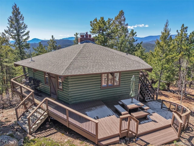 693 Rd C, Pine, CO 80470 - rear view of property featuring stairs, roof with shingles, log siding, and a deck with mountain view