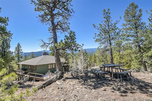 693 Rd C, Pine, CO 80470 - view of yard with a deck with mountain view