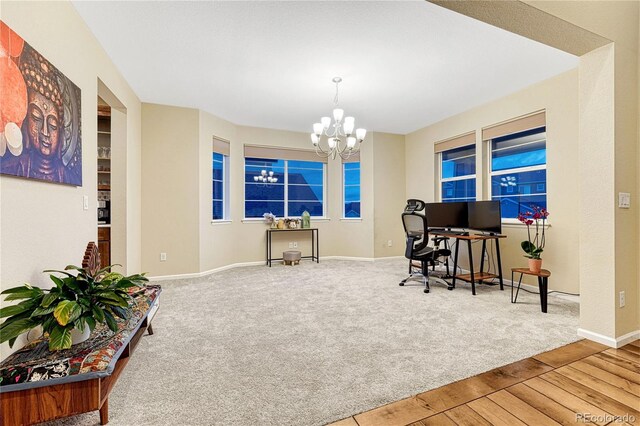 2775 Morningbird Ln, Castle Rock, CO 80109 - carpeted home office featuring a chandelier, baseboards, and wood finished floors