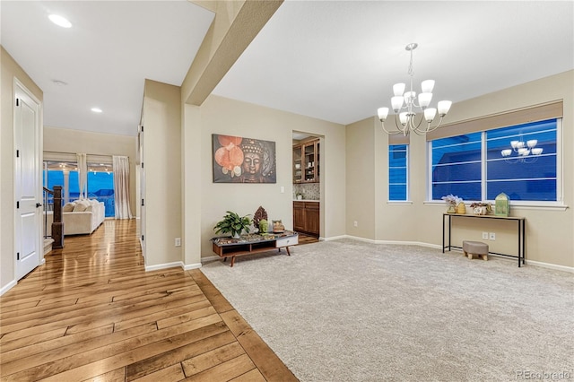 2775 Morningbird Ln, Castle Rock, CO 80109 - sitting room featuring a chandelier, baseboards, recessed lighting, wood finished floors, and carpet floors