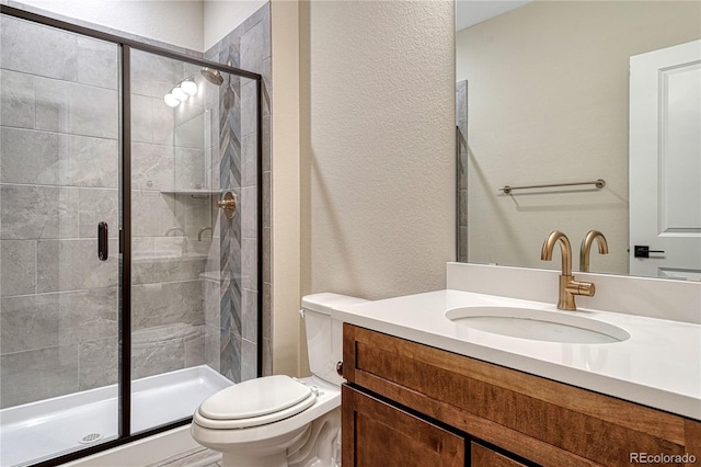 2775 Morningbird Ln, Castle Rock, CO 80109 - bathroom with toilet, a textured wall, vanity, and a stall shower
