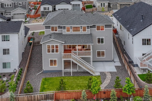 2775 Morningbird Ln, Castle Rock, CO 80109 - back of property with a residential view, stairs, a shingled roof, and a fenced backyard