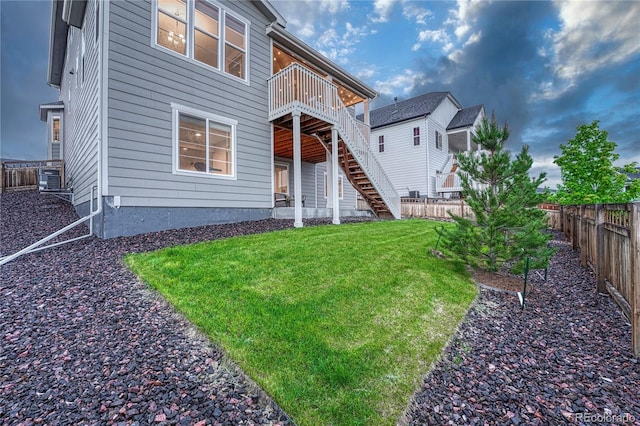 2775 Morningbird Ln, Castle Rock, CO 80109 - back of property with stairway and a wooden deck