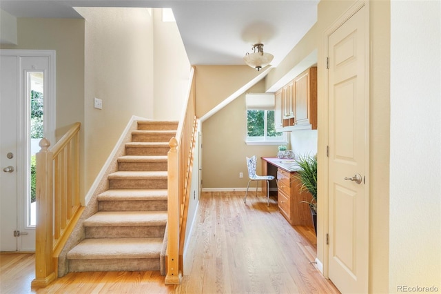 9168 W 50th Ln Unit 1, Arvada, CO 80002 - stairway featuring wood finished floors and baseboards