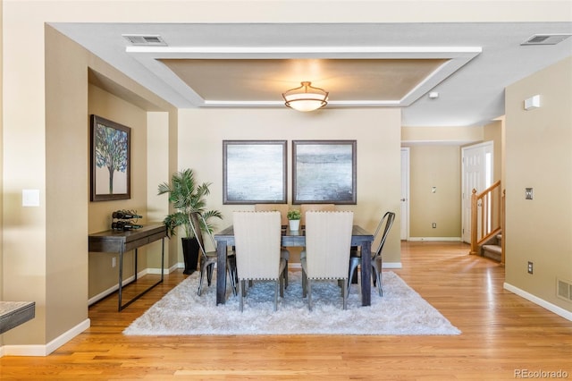 9168 W 50th Ln Unit 1, Arvada, CO 80002 - dining room featuring wood finished floors and stairs