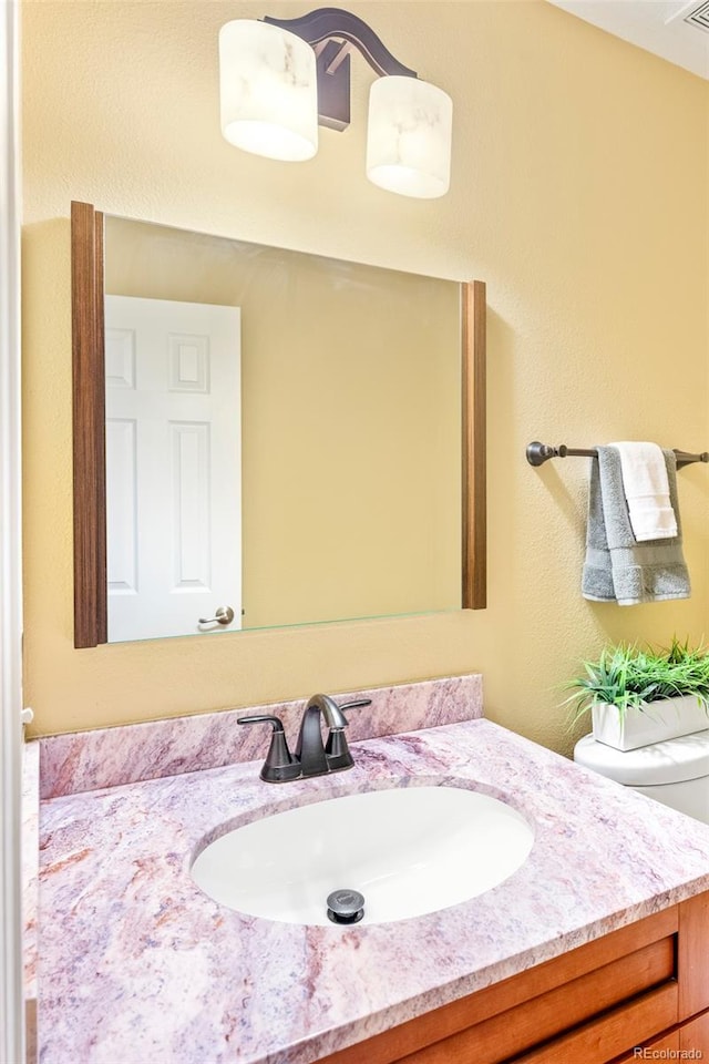 9168 W 50th Ln Unit 1, Arvada, CO 80002 - bathroom with vanity and toilet