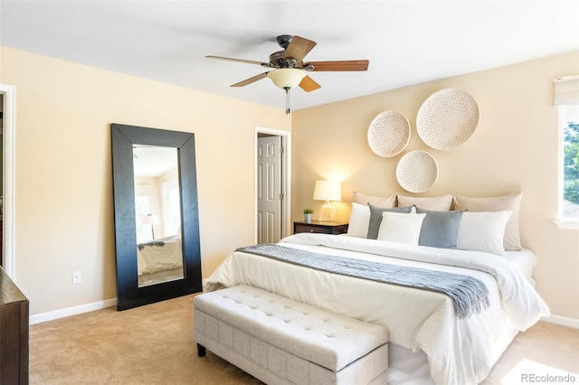 9168 W 50th Ln Unit 1, Arvada, CO 80002 - bedroom with carpet floors, multiple windows, and ceiling fan