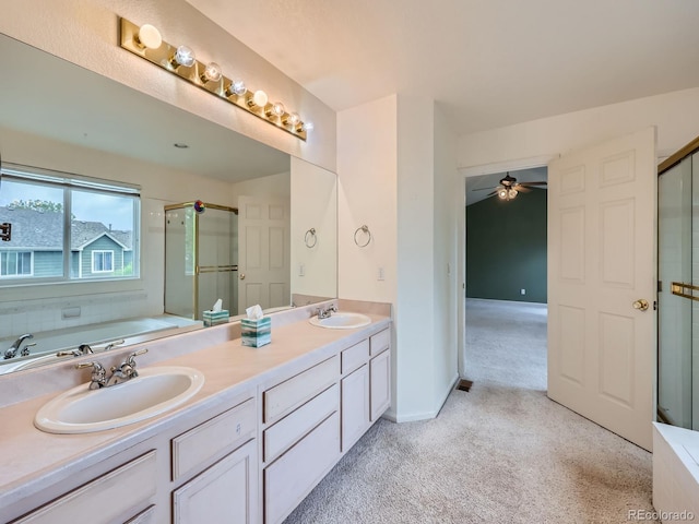 5163 Apache Creek Rd, Castle Rock, CO 80109 - bathroom with a stall shower, a ceiling fan, carpet floors, a bath, and double vanity