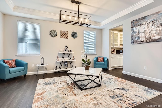 1403 Hart Ln, Elizabeth, CO 80107 - living area with ornamental molding, dark wood finished floors, a chandelier, baseboards, and a raised ceiling