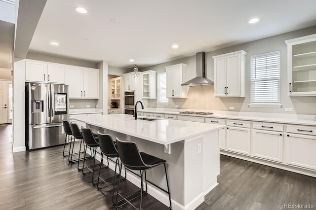 1403 Hart Ln, Elizabeth, CO 80107 - kitchen with stainless steel appliances, wall chimney range hood, a sink, dark wood-style flooring, and recessed lighting