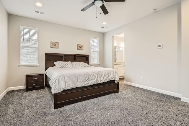 1403 Hart Ln, Elizabeth, CO 80107 - carpeted bedroom with baseboards, multiple windows, ensuite bath, and recessed lighting