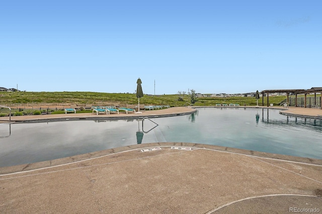 1403 Hart Ln, Elizabeth, CO 80107 - dock with a community pool and a water view
