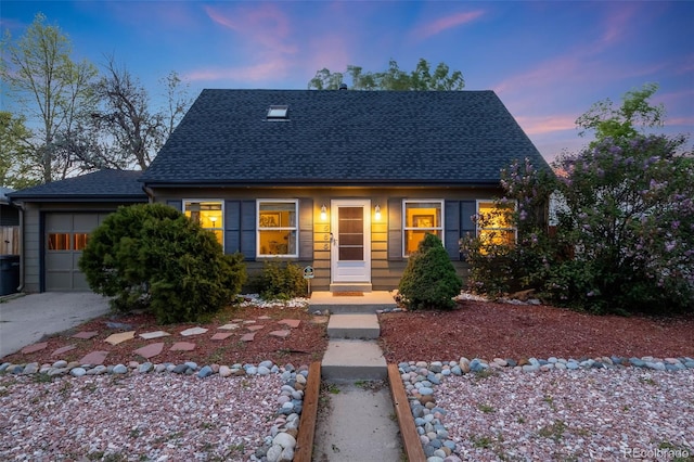 1565 Sagrimore Cir, Lafayette, CO 80026 - view of front facade with an attached garage, roof with shingles, and driveway