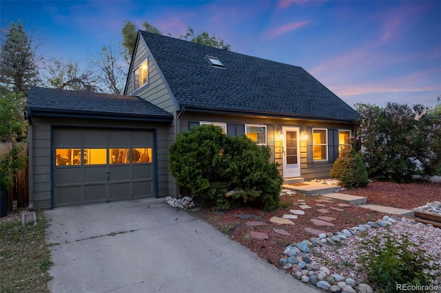 1565 Sagrimore Cir, Lafayette, CO 80026 - cape cod-style house featuring roof with shingles, concrete driveway, and a garage