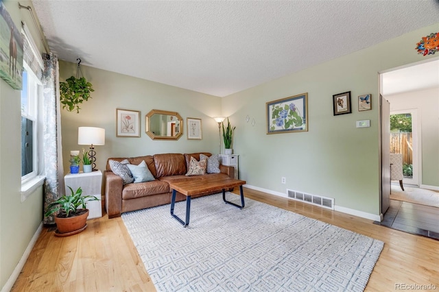 1565 Sagrimore Cir, Lafayette, CO 80026 - living area featuring wood finished floors and a textured ceiling