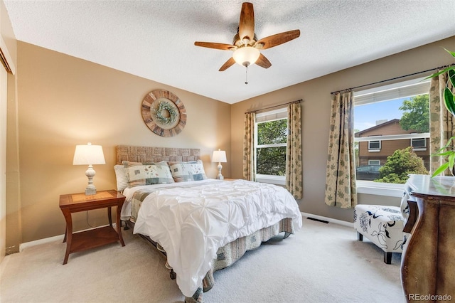 1565 Sagrimore Cir, Lafayette, CO 80026 - bedroom with light colored carpet, a textured ceiling, and ceiling fan
