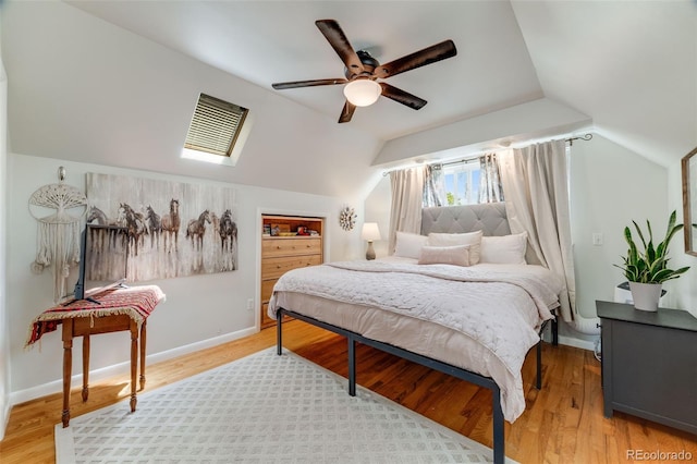 1565 Sagrimore Cir, Lafayette, CO 80026 - bedroom with lofted ceiling, light wood-style floors, ceiling fan, and a skylight