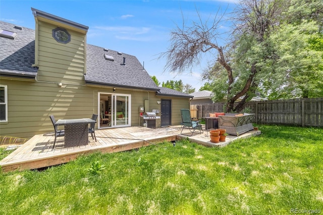 1565 Sagrimore Cir, Lafayette, CO 80026 - back of property with an outdoor living space, a fenced backyard, a shingled roof, and a wooden deck