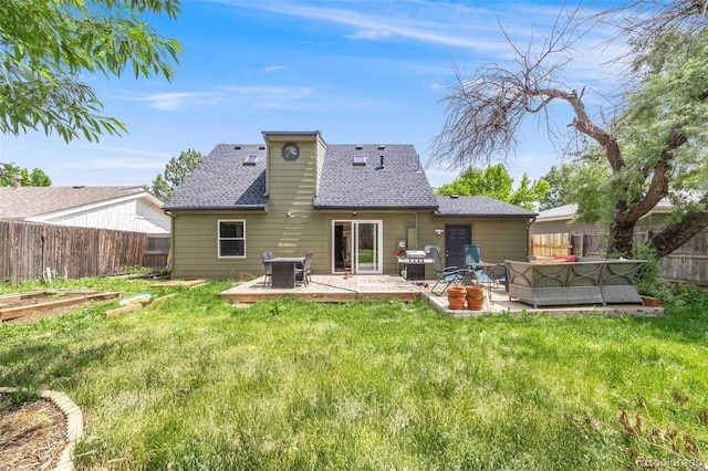 1565 Sagrimore Cir, Lafayette, CO 80026 - rear view of house featuring an outdoor hangout area, a fenced backyard, and a shingled roof