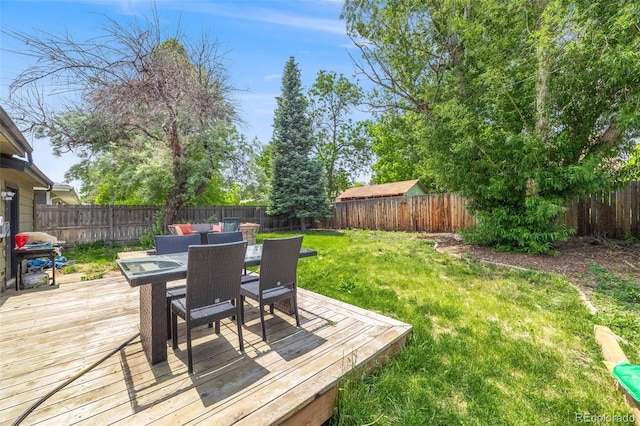 1565 Sagrimore Cir, Lafayette, CO 80026 - wooden terrace with outdoor dining space, a fenced backyard, and area for grilling