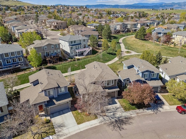 aerial perspective of suburban area featuring a mountainous background