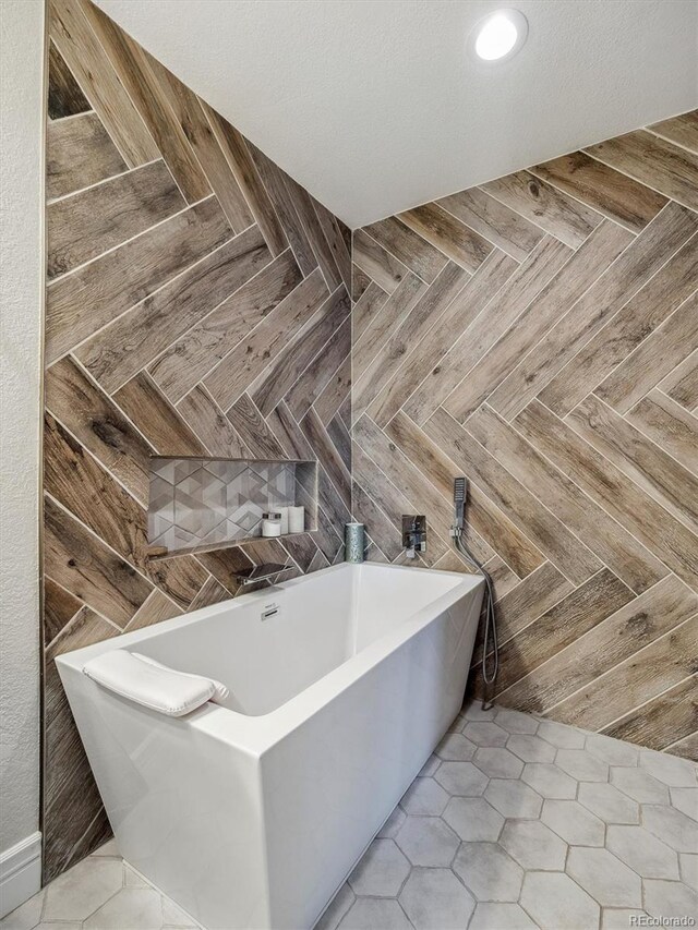 full bathroom with a freestanding bath
