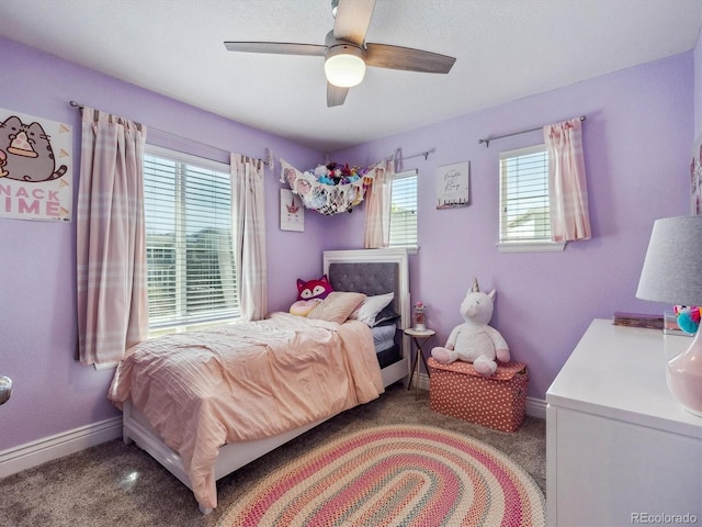 bedroom with carpet floors, baseboards, and a ceiling fan