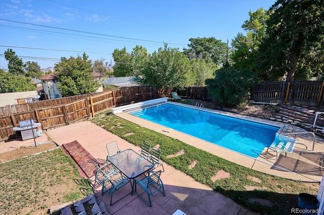2141 W Gill Pl, Denver, CO 80223 - view of pool featuring a patio and a fenced backyard