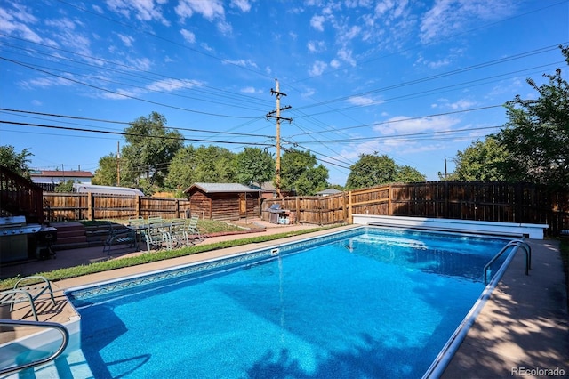 2141 W Gill Pl, Denver, CO 80223 - view of pool featuring a fenced backyard, a storage unit, and a patio area