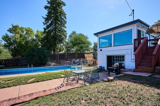 2141 W Gill Pl, Denver, CO 80223 - view of pool featuring stairway, a fenced backyard, and a patio area