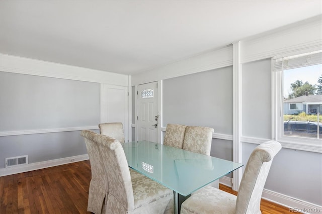 2141 W Gill Pl, Denver, CO 80223 - dining room featuring wood finished floors and baseboards
