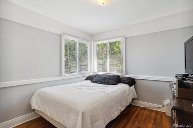 2141 W Gill Pl, Denver, CO 80223 - bedroom with wood finished floors and ornamental molding