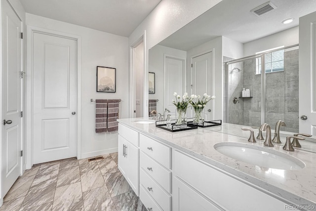 bathroom featuring vanity and walk in shower