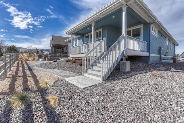 exterior space featuring cooling unit and a porch