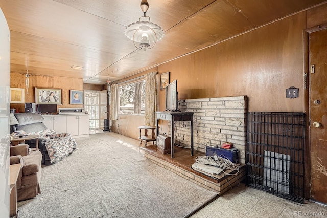 living room featuring wood walls and wooden ceiling