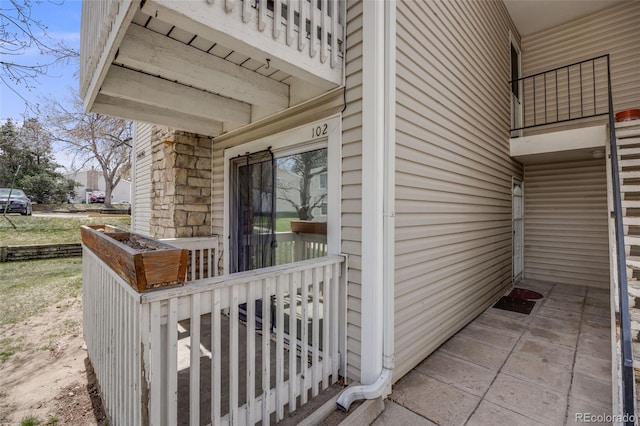 entrance to property featuring covered porch