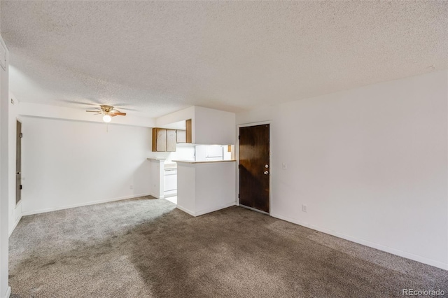 unfurnished living room featuring baseboards, carpet, a textured ceiling, and ceiling fan