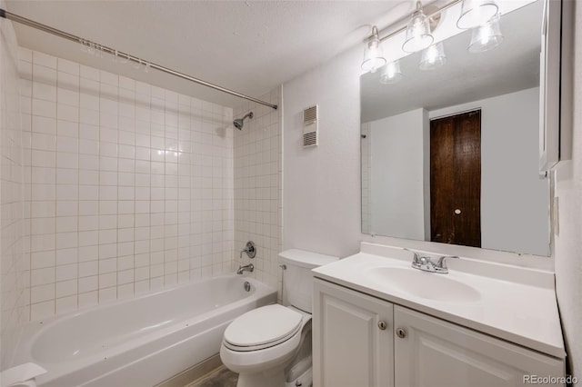 bathroom with visible vents, bathing tub / shower combination, toilet, and vanity