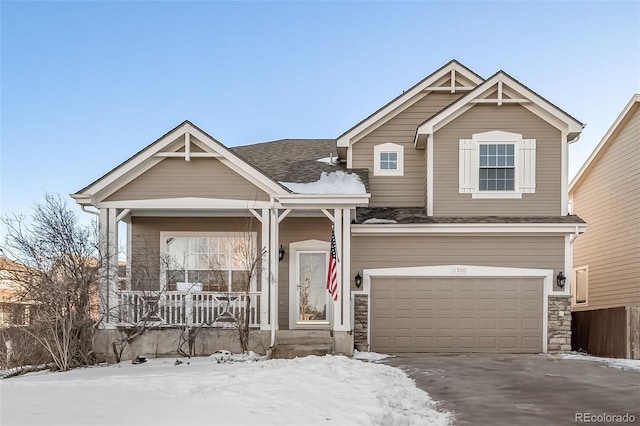 craftsman house with a garage and a porch